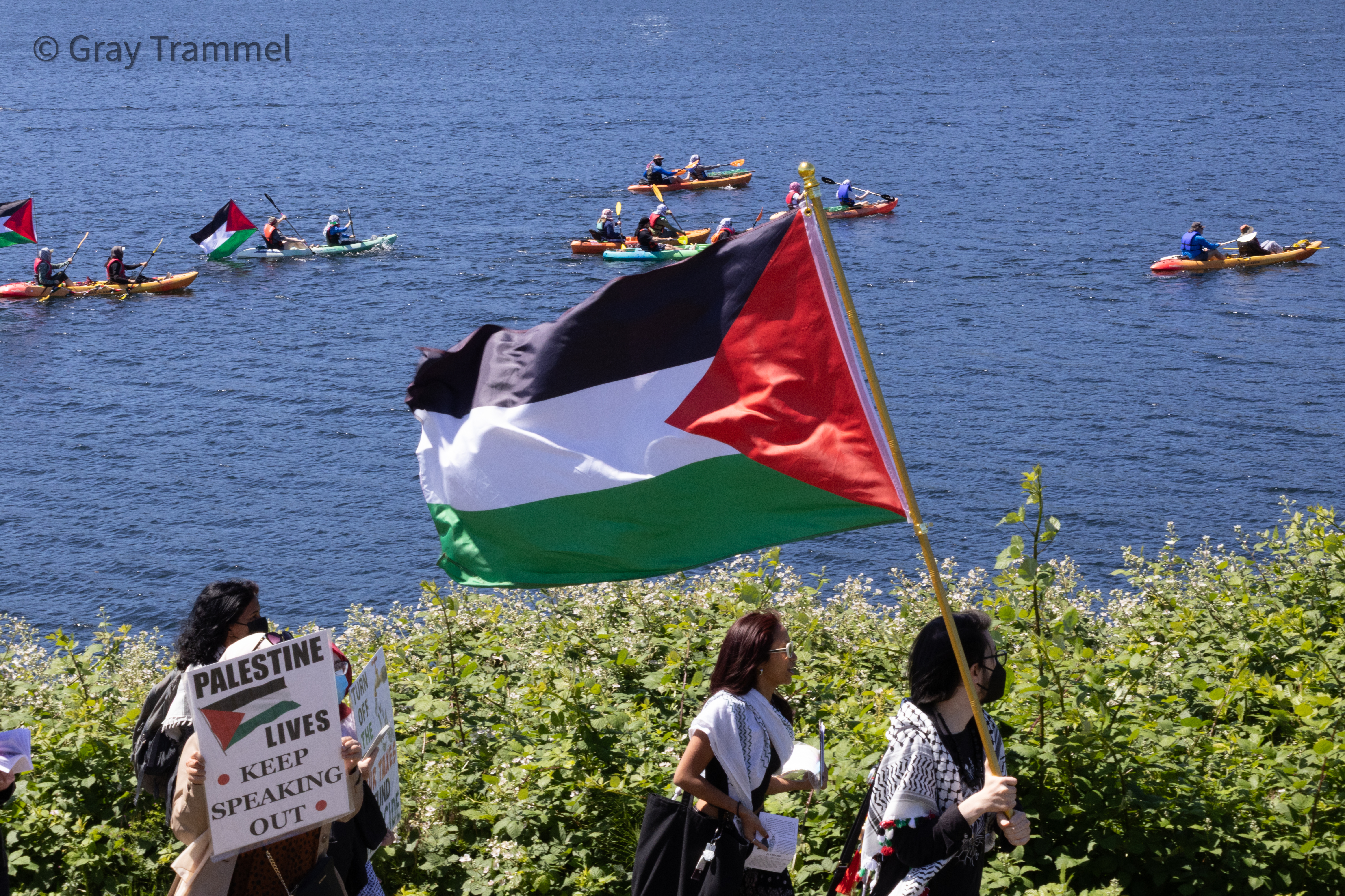 Activists protest weapons manufacturer Anduril in Seattle’s ship canal on land and&nbsp;water