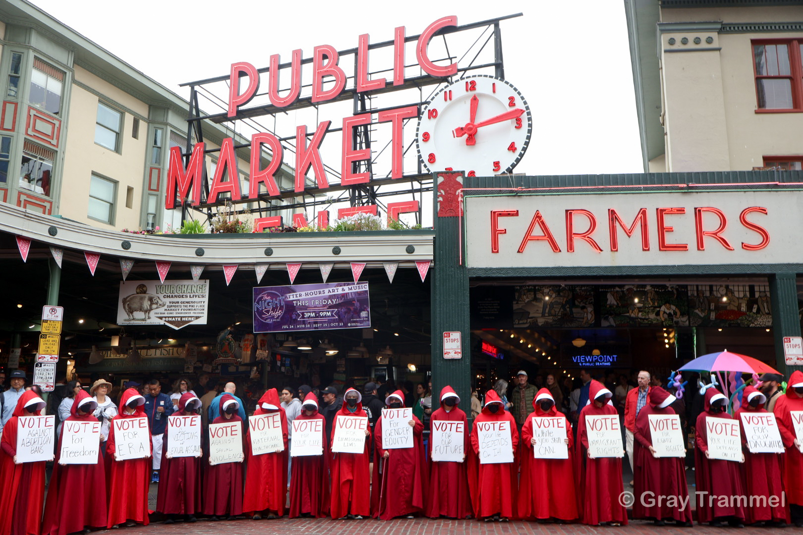 Seattle Handmaids hold large demonstration at Pike Place Market to emphasize global and local oppression